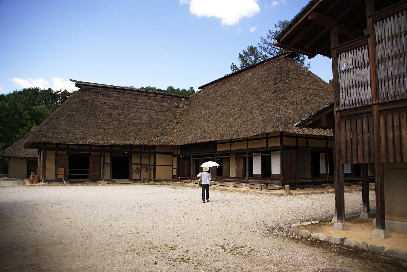 Thatched magariya farmhouses around an open courtyard at Tono Furusato Village.